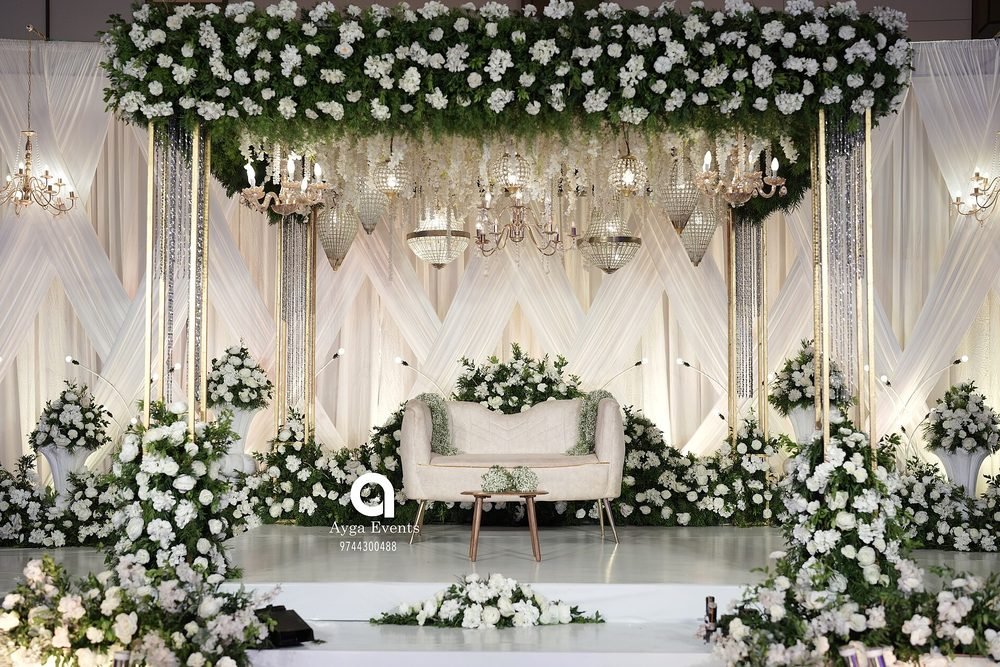 Decorated wedding stage with floral backdrop