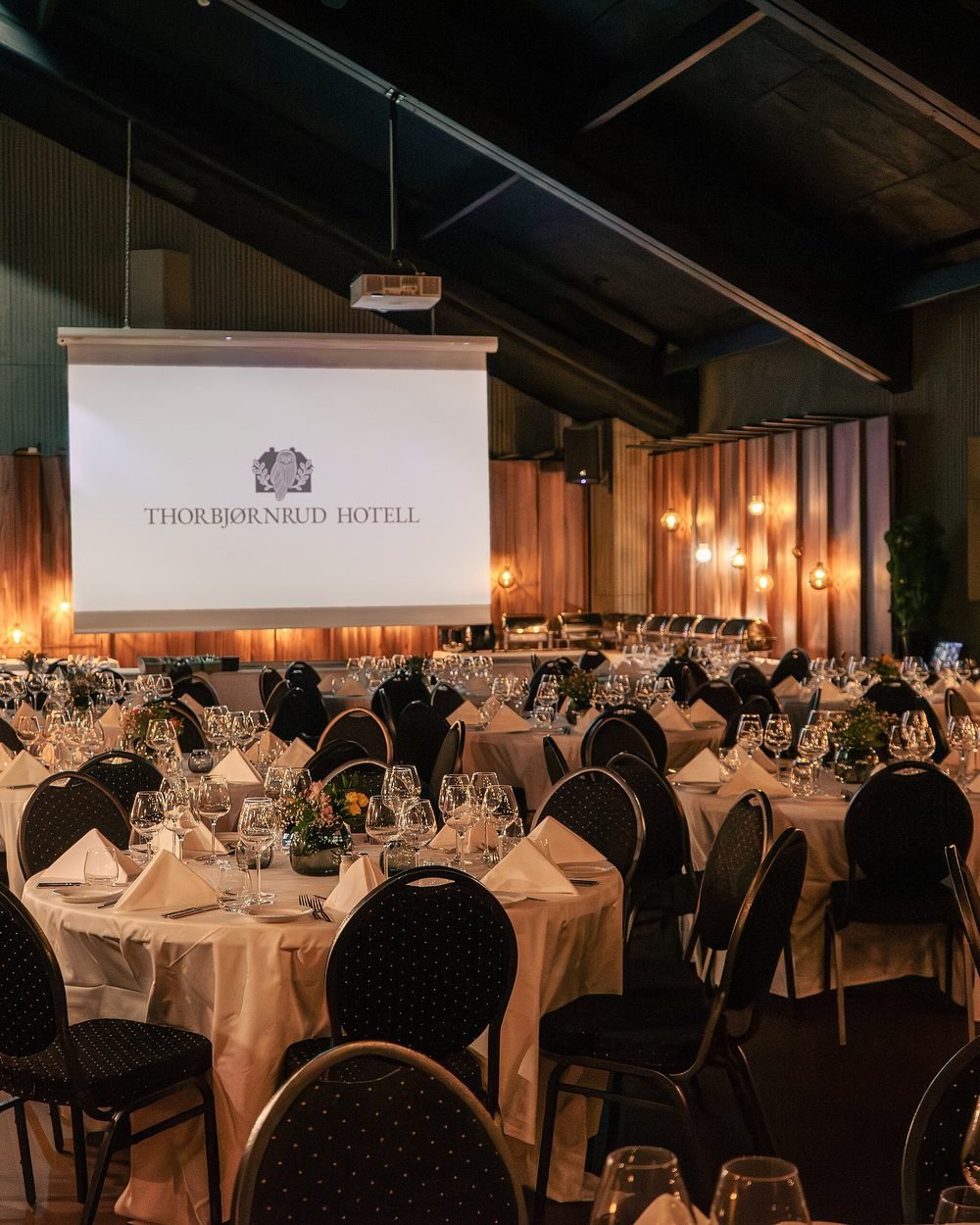 Main banquet hall set with seating and stage